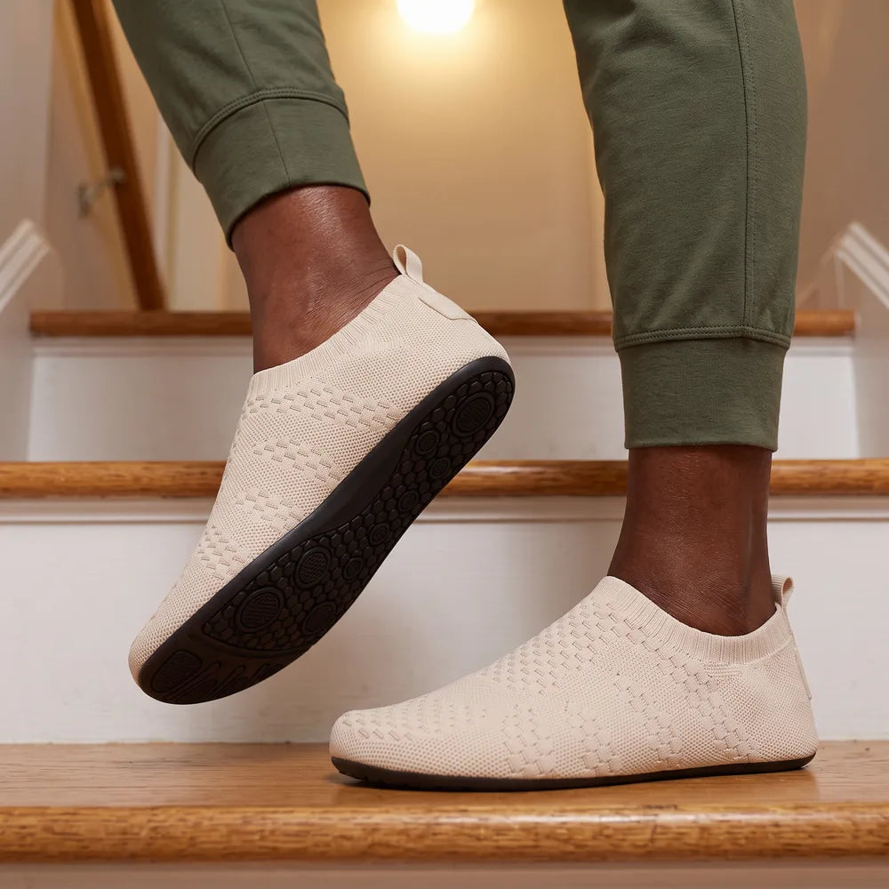 Cloud Sock Shoes in Beige worn on the basement stairs