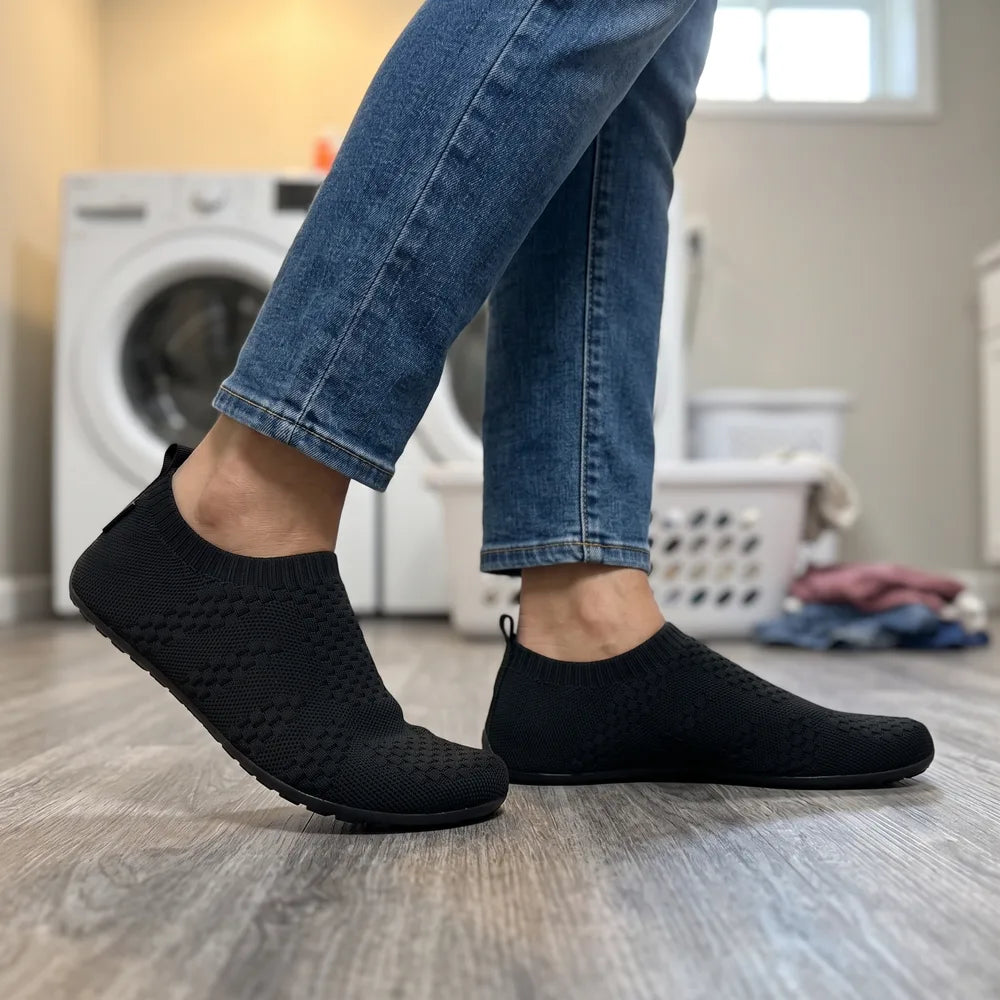 Cloud Sock Shoes in Black worn in the basement laundry room