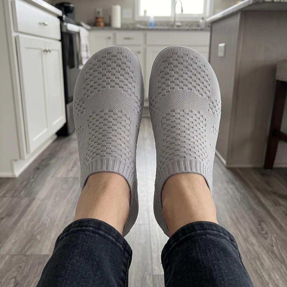 Cloud Sock Shoes in Grey worn in the kitchen, top view