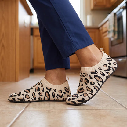 Cloud Sock Shoes in Leopard Beige worn in the kitchen with scrub pants