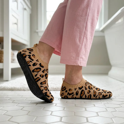 Cloud Sock Shoes in Leopard Brown worn in the bathroom, grippy rubber sole