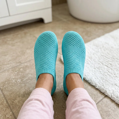 Cloud Sock Shoes in Turquoise worn in the bathroom, top view