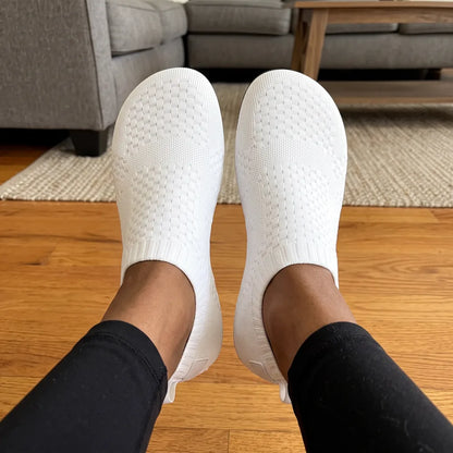 Cloud Sock Shoes in White worn in the living room, top view